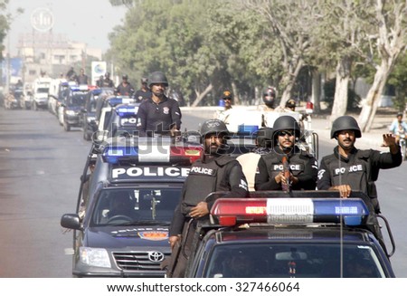 KARACHI, PAKISTAN - OCT 14: Rangers and Sindh Police staffs are jointly holding a flag march to maintain law and order situation during the month of Moharram-ul-Haram on October 14, 2015 in Karachi.