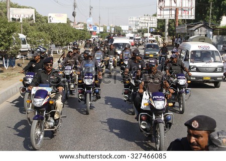 KARACHI, PAKISTAN - OCT 14: Rangers and Sindh Police staffs are jointly holding a flag march to maintain law and order situation during the month of Moharram-ul-Haram on October 14, 2015 in Karachi.