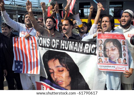 PESHAWAR-SEPT 25: Activists of Pasban Pakistan chant slogans against American Government and for the release of Dr.Aafia Siddiqui during a protest demonstration outside Peshawar Press Club Sept 25, 2010