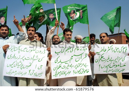 PESHAWAR-SEPT 25: Activists of PML-N chant slogans against American Government and for the release of Dr.Aafia Siddiqui during a protest demonstration outside Peshawar Press Club Sept 25, 2010