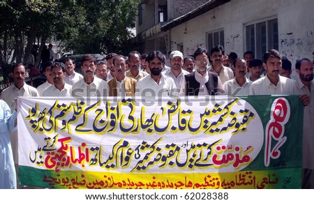 RAWALAKOT,PAKISTAN-SEPT 29:Employees of Jammu Kashmir (AJK) Government protest in favor of Kahmiri people during demonstration to condemn the violent behavior of Indian Army Sept 29, 2010 in Rawalakot