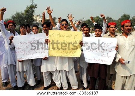 PESHAWAR, PAKISTAN - OCT 19: Activists of Azad Pakhtoon Students Federation are protesting for recovery of Ajmal Khan during demonstration on October 19, 2010 in Peshawar, Pakistan.