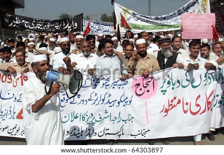 PESHAWAR, PAKISTAN - NOV 02: Activists of WAPDA Hydro Electric Central Labour Union chant slogans in favor of their demands during protest demonstration on November 02, 2010 in Peshawar, Pakistan.