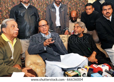 LAHORE, PAKISTAN - DEC 05: Muslim League-Q President, Ch.Shujaat Hussain, along with renowned actor, Jamil Fakhri addresses press conference at his residence on December 05, 2010 in Lahore, Pakistan.
