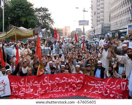 KARACHI, PAKISTAN - DEC 20: Members of Qasim Harbor and Dock Workers Union chant slogans in favor of their demands during a protest demonstration press club on December 20, 2010 in Karachi, Pakistan.