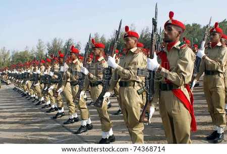HYDERABAD, PAKISTAN - MAR 31: Recruits present guard of honor during their passing out parade ceremony held at Sindh Regimental Centre on March 31, 2011in Hyderabad, Pakistan.