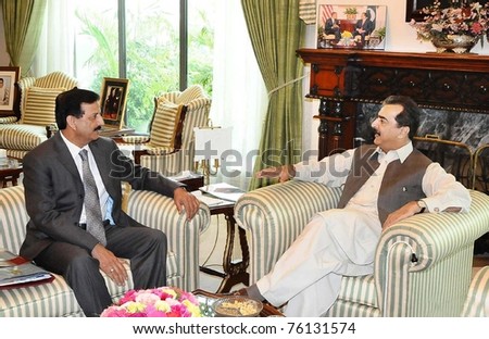 ISLAMABAD, PAKISTAN - APR 27: Prime Minister, Syed Yousuf Raza Gilani, talks with Lt.Gen.(Retd)Syed Athar Ali, Secretary for Defence, during meeting at PM House on  April 27, 2011in Islamabad, Pakistan.