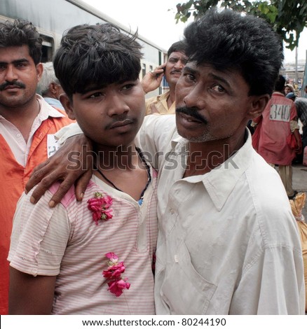 KARACHI, PAKISTAN - JUN 30: A released fisherman, who was released by Indian Government, being welcomed by his relative when he came out from passenger train on June 30, 2011in Karachi.