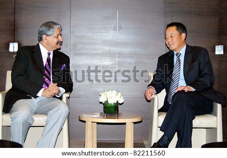 BEIJING, CHINA - AUG 03: Pakistan Water and Power Minister, Syed Naveed Qamar talks with Nie Kai President China Gazhouba Group Corporation, during meeting in Beijing on August 03, 2011.