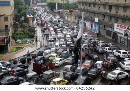 KARACHI, PAKISTAN - SEPT 06: A long queue of vehicles stuck in a traffic jam at Hotel Metropole during heavy downpour of monsoon season in Karachi on September 06, 2011.