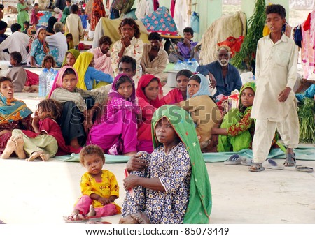 HYDERABAD, PAKISTAN - SEPT 20: Rain and flood affected people from different areas of Sindh province are living at New Sabzi Mandi relief camp on September 20, 2011Hyderabad. Unidentified people