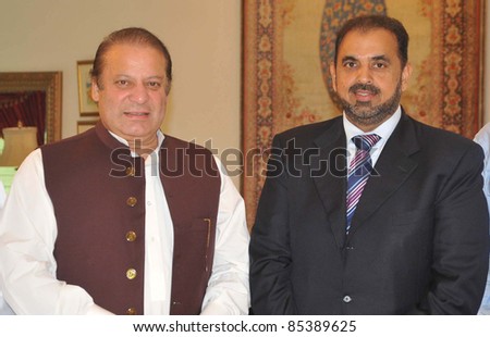 LAHORE, PAKISTAN - SEPT 24: Muslim League-N President, Nawaz Sharif in group photo with Member of the UK Parliament Lord Nazir Ahmad during a meeting on September 24, 2011in Lahore.