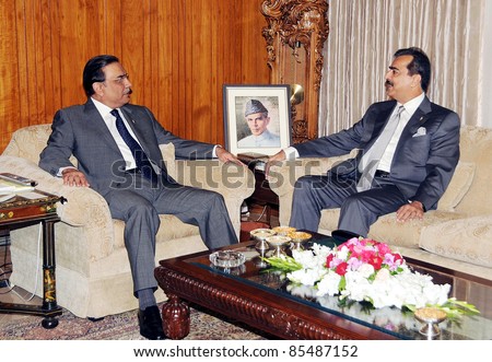 ISLAMABAD, PAKISTAN - SEPT 27:  President, Asif Ali Zardari exchanges views with Prime Minister, Syed Yousuf Raza Gilani during meeting at Aiwan-e-Sadr on September 27, 2011in Islamabad, Pakistan.