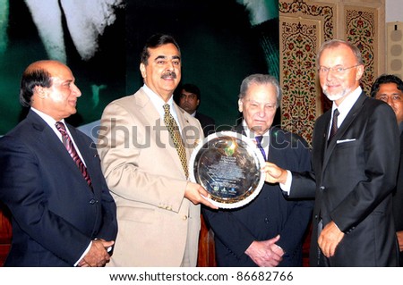 LAHORE, PAKISTAN - OCT 15: Prime Minister, Syed Yousuf Raza Gilani distributes Presidential Iqbal Awards -2011 during ceremony held  on October 15, 2011 in Lahore.