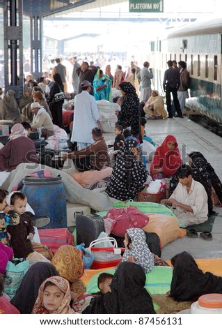QUETTA, PAKISTAN - OCT 26: Passengers gather at platform while they are facing problems due to protest of railways employees in favor of their demands on October 26, 2011in Quetta.