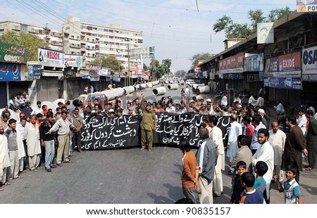 KARACHI, PAKISTAN - DEC 14: Shopkeepers of KMC Market Garden are protesting in favor of their demands during demonstration in Karachi on December 14, 2011 in Karachi, Pakistan.