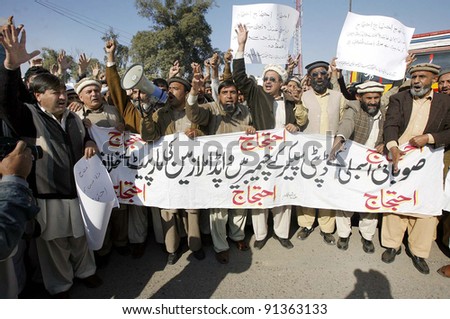 PESHAWAR, PAKISTAN - DEC 23: Members of WAPDA Hydro Electric Central Labor Union are protesting in favor of their demands during demonstration  on  December 23, 2011in Peshawar.