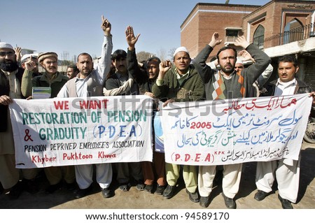 PESHAWAR, PAKISTAN - FEB 07: Members of Pensioners Deprived Employees Association chant slogans in favor of their demands during a protest demonstration press club on February 07, 2012 in Peshawar.