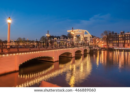 Similar – Image, Stock Photo Bridge over the Amstel river at night in Amsterdam