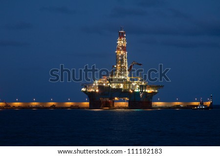 horizontal oil drilling platform at night in Canary Islands