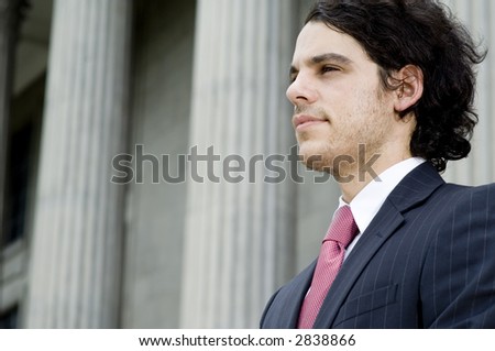 A young businessman looking forward to the future