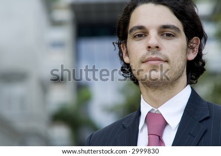 A young male business person outside (shallow depth of field used)