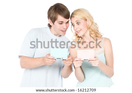 A young couple happily gaming together