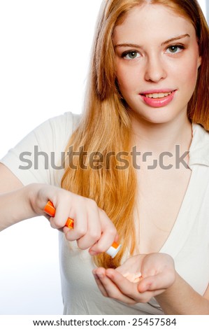 A young attractive woman taking medication