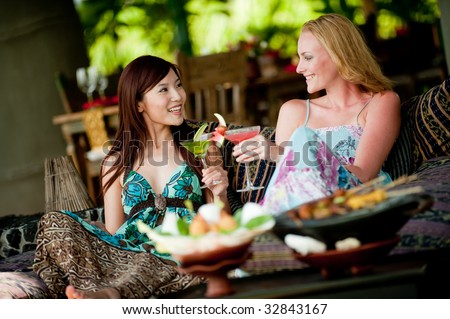 http://image.shutterstock.com/display_pic_with_logo/64665/64665,1246278666,2/stock-photo-two-young-attractive-women-having-lunch-and-drinks-on-vacation-32843167.jpg