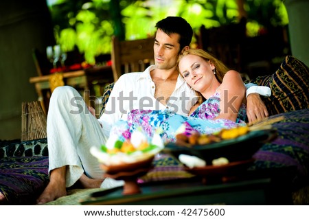 A young couple enjoying a relaxed lunch at a restaurant