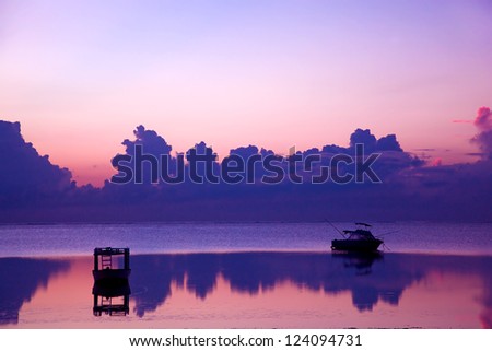 Ocean sunset, boat. Indian Ocean, African shore