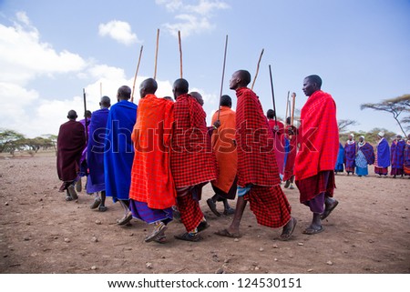 Maasai village, TANZANIA, AFRICA - DECEMBER 11: A group of Maasai men performing their ritual dance in traditional clothes in their village on December 11, 2012 in Tanzania.