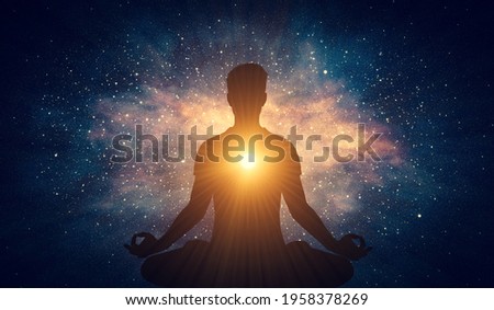 Man and soul. Yoga lotus pose meditation on nebula galaxy background. Zen, spiritual well-being. 3D illustration