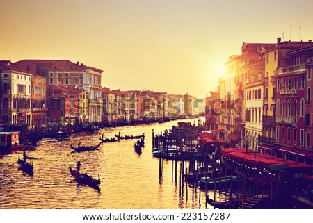 Venice, Italy. Gondolas on Grand Canal, Italian Canal Grande at gold sunset. View from Rialto Bridge. Vintage, retro style