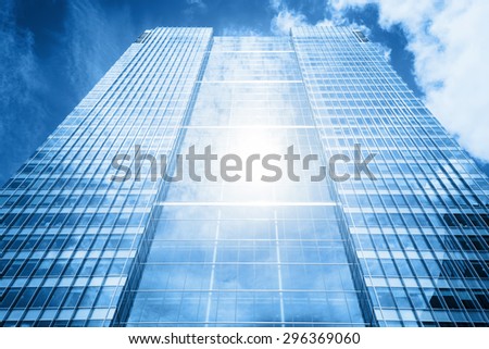 Sun reflecting in a usual modern business skyscraper, high-rise building, architecture raising to the sky Concepts of financial, economics, future etc.