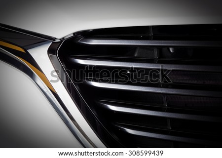 Modern luxury car close-up of grille. Background, concept of expensive, sports auto detailing