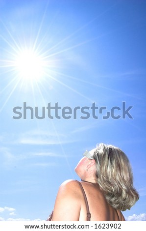 Beautiful woman facing towards the sun
