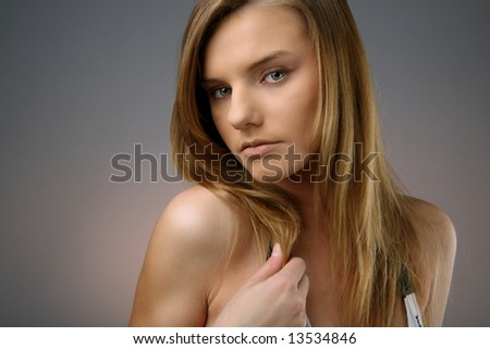 head shot of young woman with long hair