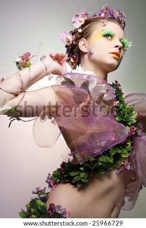 Young beautiful woman dressed as Spring.