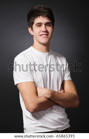 Young attractive happy man wearing white T-shirt.