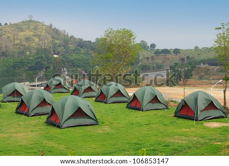 Many Tents on green grass, Ready for summer camping fun.