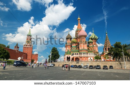 MOSCOW - JULY 13: Tourists visiting the Red Square on july 13, 2013 in Moscow, Russia. St. Basil's Cathedral and the Kremlin are the main attractions of the Red Square.