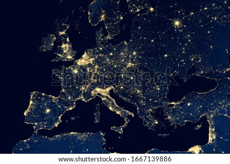 Europe map in global satellite photo, view of city lights on night Earth from space. EU and Mediterranean in world. Elements of this image furnished by NASA.