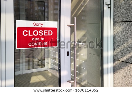 Business center closed due to COVID-19, sign with sorry in door. Stores, offices, other public places temporarily closed during coronavirus pandemic. Economy hit by corona virus. Lockdown concept.