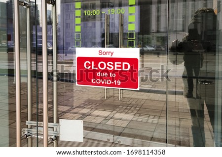 Business center closed due to COVID-19, sign with sorry in door. Stores, offices, other commercial buildings temporarily closed during coronavirus pandemic. Economy crisis and lockdown concept. Stock foto © 
