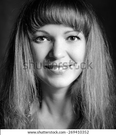 Black and white portrait of a happy young woman