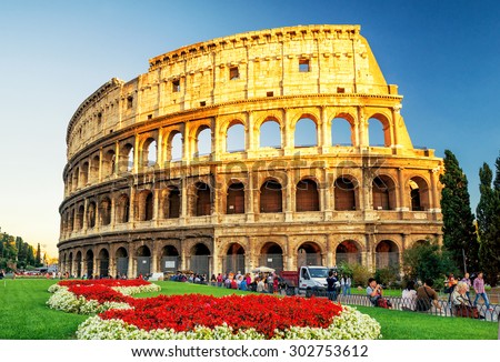 ROME - OCTOBER 4, 2012: The Colosseum (Coliseum) at sunset. The Colosseum is a major tourist attraction in Rome.