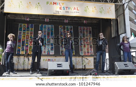 NEW YORK - APRIL 28: Cast of Broadway musical Rock of Ages performs on stage at Family festival during the 2012 Tribeca Film festival on Greenwich street on April 28, 2012 in New York City
