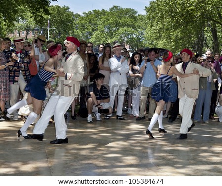 NEW YORK - JUNE 16: Jen Zakrzewski & Roddy Caravella (on the left) and partners dance at 7th Annual Jazz age concert and picnic on Governors Island on June 16 2012 in New York