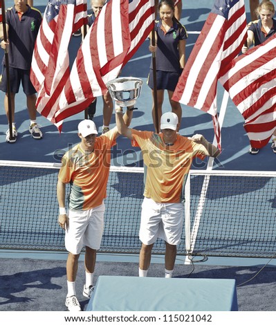 NEW YORK - SEPTEMBER 07: Bob & Mike Bryan of USA with winner trophy for men double at US Open tennis tournament on September 7, 2012 in New York City